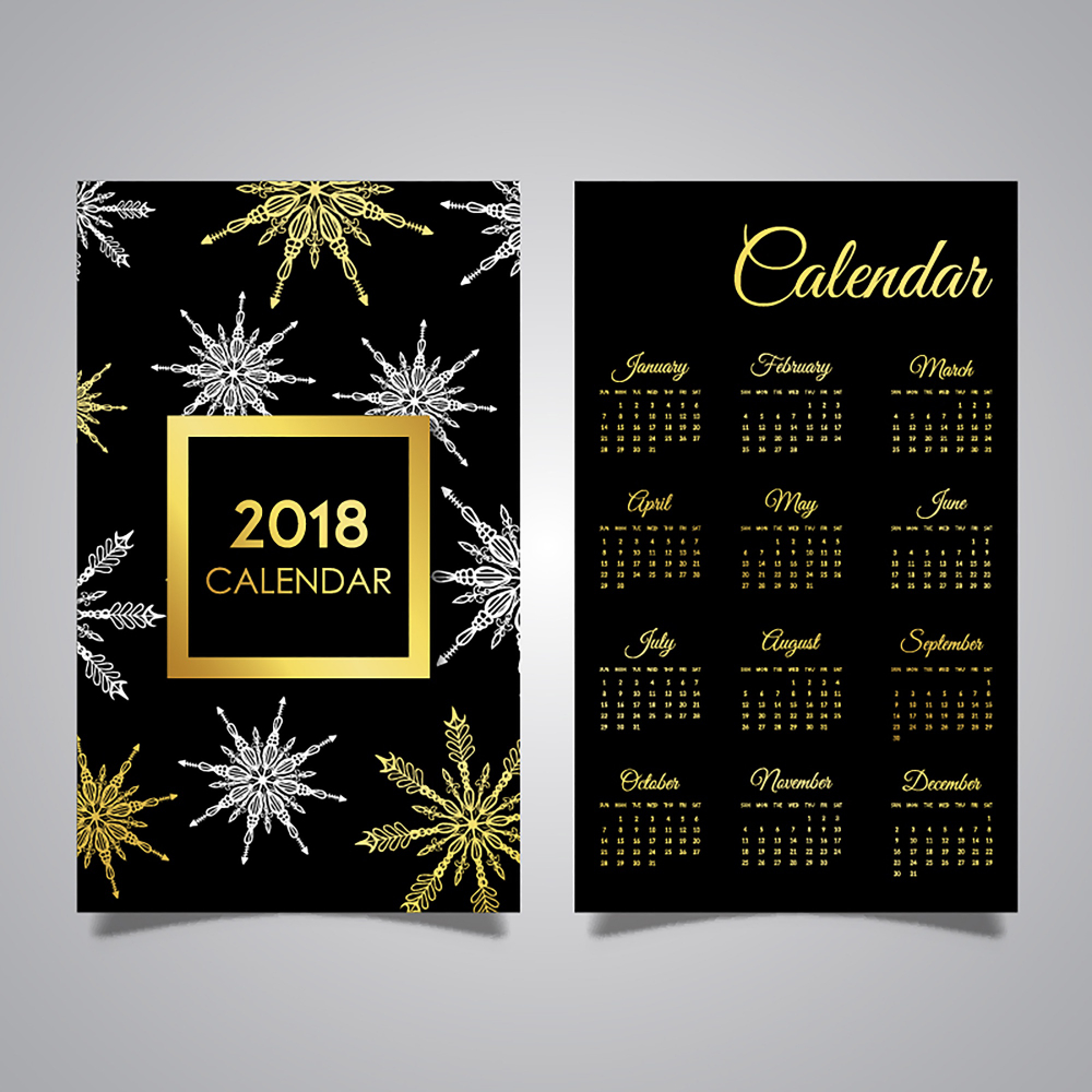 2018 decorative calendar with gold and silver snowflake design elements.