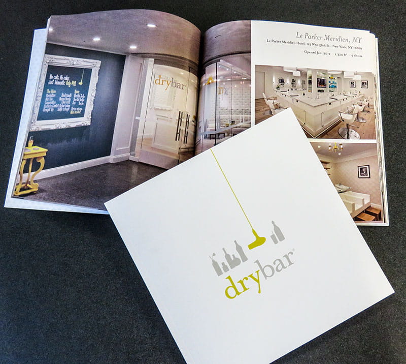 Drybar promotional booklet displaying salon interiors and branding.