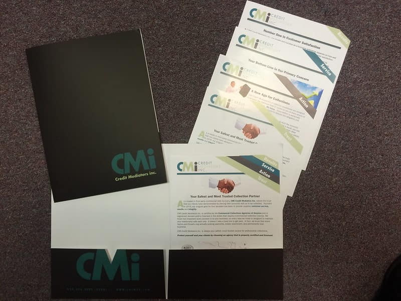 CMi Credit Midwestern folder with printed brochures and inserts.