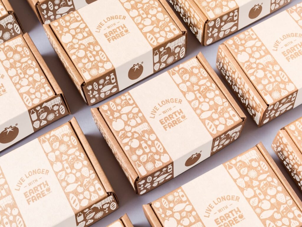 Recyclable Earth Fare boxes with printed “Live Longer” branding design.