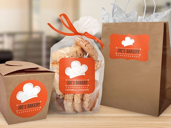 Joe’s Bakery branded packaging including bag, cookie bag, and food box.
